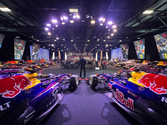 JT Foxx speaking to an audience surrounded by Red Bull Racing cars